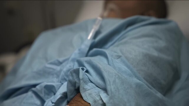 Intensive care setting showing patient with fulminant meningococcemia marked by diffuse vascular skin lesions.