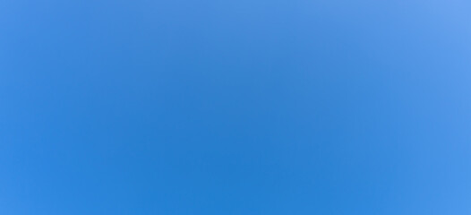 Low angle view and full frame of beautiful light blue sky without clouds in the afternoon on sunny day used as natural background texture in decorative art work