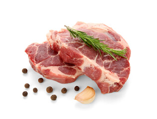 Fresh raw steaks with rosemary, garlic and peppercorns on white background