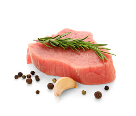 Fresh raw steak with rosemary, garlic and peppercorns on white background
