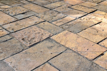 aged stone pavement texture, weathered sandstone tile of historic site