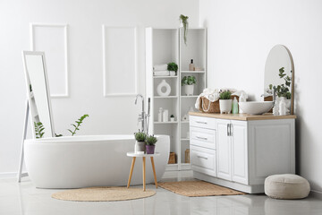 Interior of modern white bathroom with pots of lavender flowers