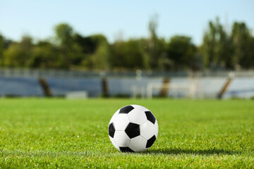 Soccer ball on green stadium grass
