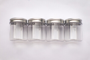 A Group of Bottles or Jars Packaging Mockup on an Isolated White Background