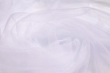 Fototapeta premium A close-up photo of beautiful, elegant, soft, detailed, textured, and wavy tulle fabric.