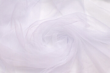 Fototapeta premium A close-up photo of beautiful, elegant, soft, detailed, textured, and wavy tulle fabric.