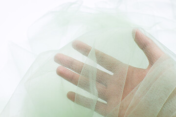 A close-up photo of beautiful, elegant, soft, detailed, textured, and wavy tulle fabric.