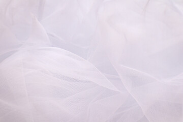 Obraz premium A close-up photo of beautiful, elegant, soft, detailed, textured, and wavy tulle fabric.