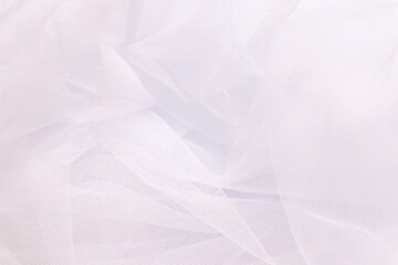 A close-up photo of beautiful, elegant, soft, detailed, textured, and wavy tulle fabric.