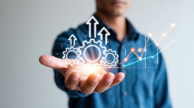 Driving Operational Productivity: A hand presenting glowing gears with upward arrows and a growth chart, illustrating streamlined processes, efficiency gains, and business expansion.