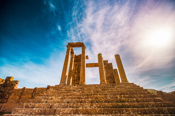 A striking low-angle shot showcases a series of remarkably preserved ancient Roman columns standing...