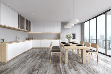 Bright, airy interior of a modern kitchen & dining area with hardwood floor