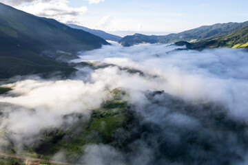 Landscape of Morning Mist with Mountain Layer. mountain ridge and clouds in rural jungle bush forest