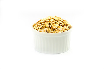 Oatmeal in a bowl on a white background. Oatmeal in a cup. Contains antioxidants, which can help reduce the risk of high blood pressure.