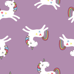 Charming and colorful seamless vector pattern of white unicorns with rainbow tails and heart motifs on a soft purple background. Designed for children’s fashion, baby apparel, nursery art, stationery,