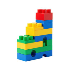 Vibrant multi-colored plastic building blocks (red, yellow, blue, green) stacked in an abstract stepped pattern against a transparent studio background with shadowless light, sharp focus. Childhood