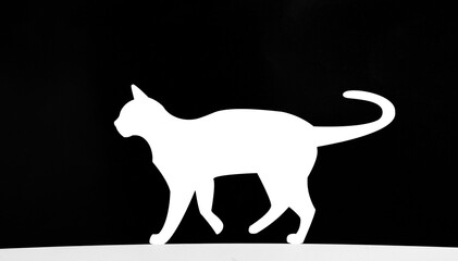1 one alone cat pussycat silhouette illustration collection. white silhouette isolated on a black background showing  cat walking pose. ideal for pet themed designs
