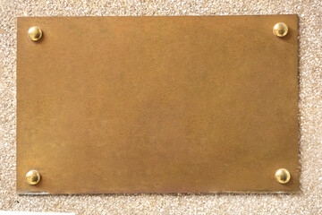 Fototapeta premium empty Mock up of yellow golden metal sign. Blank steel name plate on concrete wall. Signboard template mockup Gold iron Signboard on stucco plaster Wall for Modern Business Exterior Design Mock up