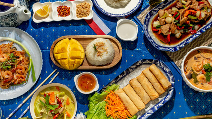 A tapestry of Thai delicacies on a cobalt cloth, evoking Songkran flavors, vibrant piquant harmony, and culinary tales