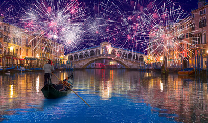 Romantic gondola ride near Rialto Bridge with fireworks -  Venice, Italy © muratart