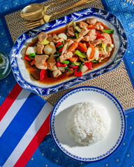 Stir-fried delight in ornate dish bursts vibrant Thai New Year flavors, vibrant dinner invoking Songkran festival, culinary artistry