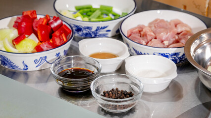 Ceramic bowls with vibrant stir-fry ingredients, culinary symphony for Lunar New Year feast, tantalizing fusion, peppered yin-yang harmony