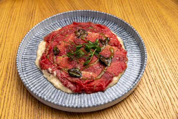 Beef carpaccio with truffle oil
