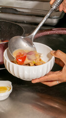 Aromatic Thai hotpot brimming with vibrant veggies, evoking Songkran's convivial warmth, Asian cuisine tapestry, culinary harmony in a bowl