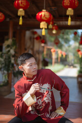 A man dressed in Chinese New Year clothing