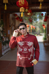 A man dressed in Chinese New Year clothing
