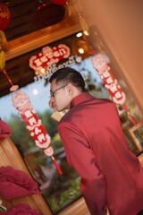 A man dressed in Chinese New Year clothing