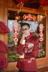 A man dressed in Chinese New Year clothing