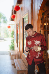 A man dressed in Chinese New Year clothing