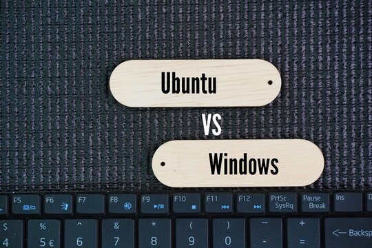 Laptop keyboard with the two words Ubuntu and Windows. Ubuntu is a Linux distribution, while Windows is a proprietary operating system developed by Microsoft