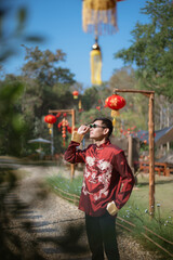 A man dressed in Chinese New Year clothing