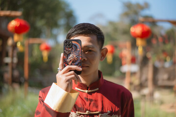 A man dressed in Chinese New Year clothing