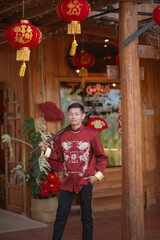 A man dressed in Chinese New Year clothing