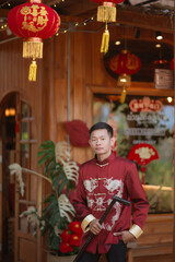 A man dressed in Chinese New Year clothing