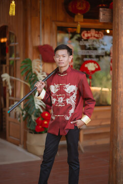 A man dressed in Chinese New Year clothing