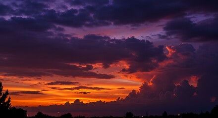 Obraz premium Dramatic Sunset with Vibrant Clouds