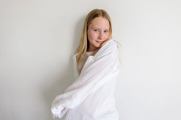 Soft portrait of confident youth in white shirt expressing inner calm