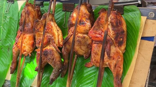Herb-Grilled Chicken with Stuffed Intestines ,Thai Street Food Favorite.