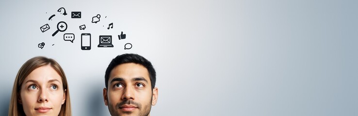 Thoughtful people looking up at digital communication icons on light background with copyspace for advertising or promotional concept design.