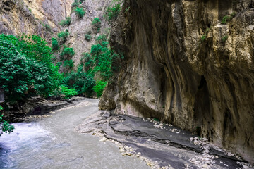 Ancient Stone Path Leading to a Cold Waterfall in Fethiye’s Forest

