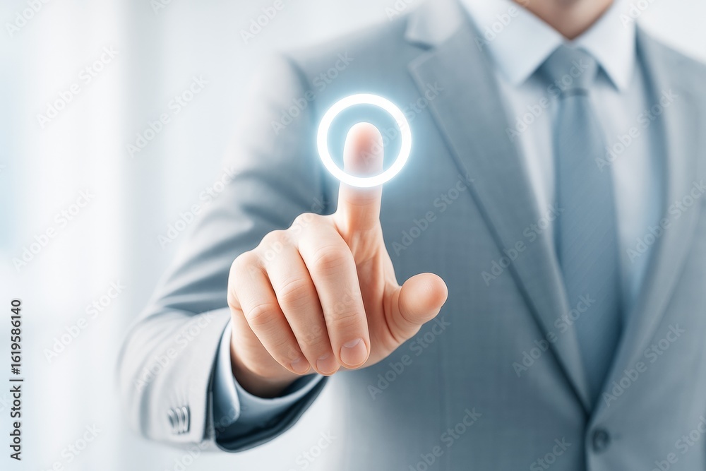 Wall mural businessman in suit touching glowing virtual button with finger on futuristic tech background in mod