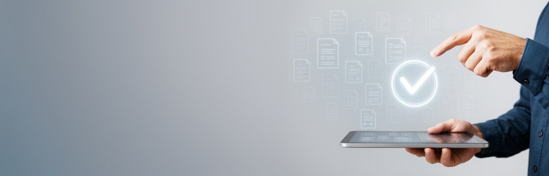Businessman using digital tablet with virtual document approval icon on modern light background, concept of online validation and digital technology.