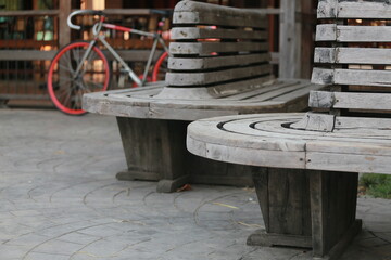 Naklejka premium Wooden Benches and Bicycle