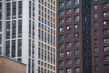 empty glass windows of a modern building with a reflection of the sky in the glass