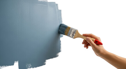 Hand holding paintbrush applying blue paint to textured surface painting transparent background