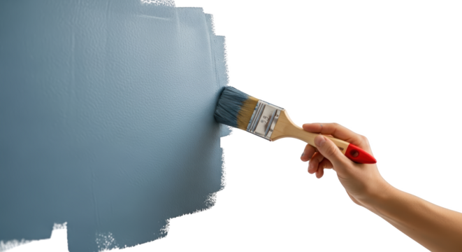 Hand holding paintbrush applying blue paint to textured surface painting transparent background